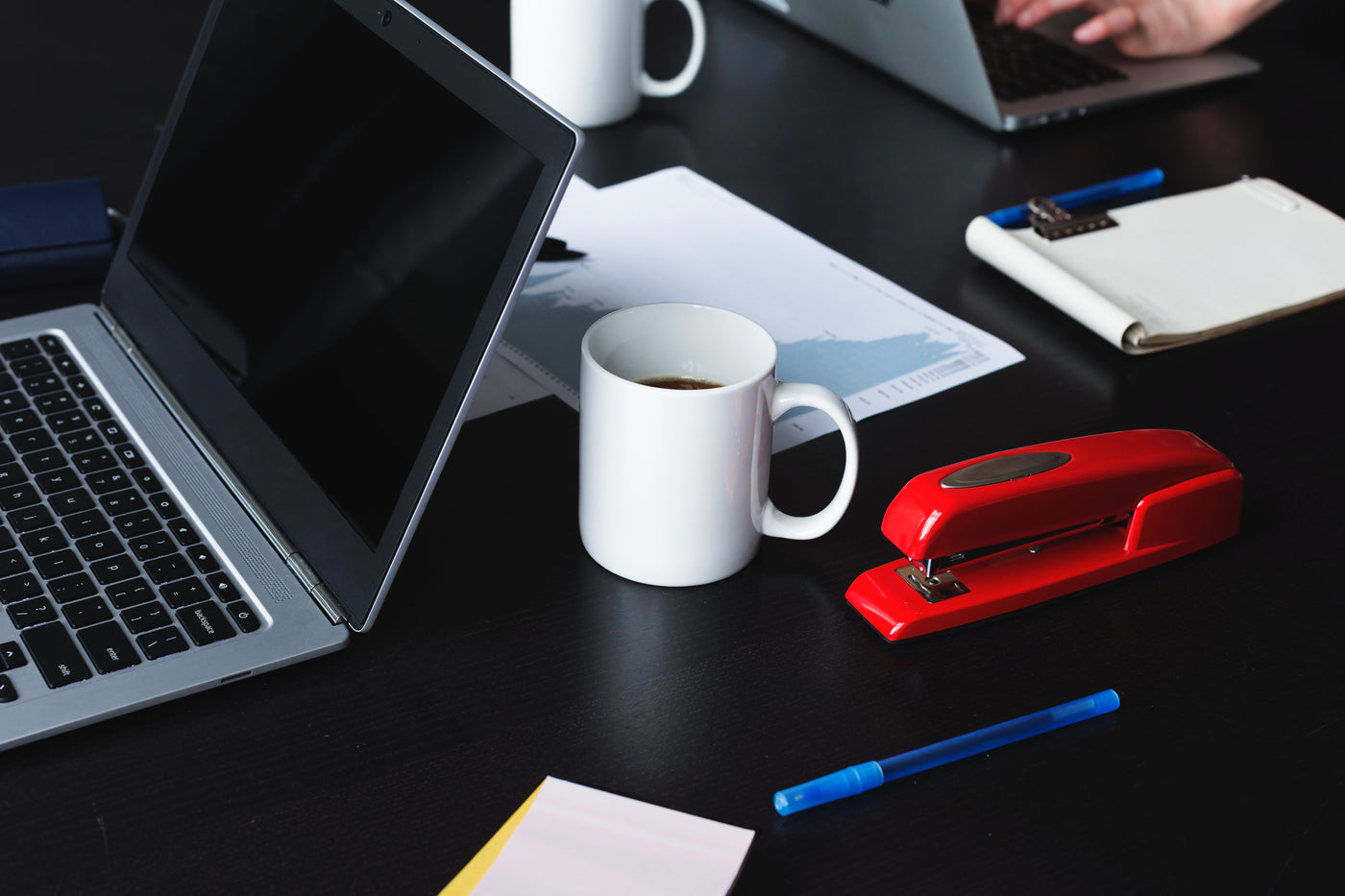 Office workspace with laptop and desk supplies